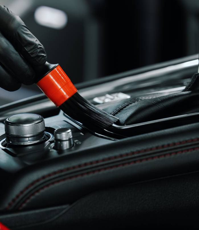 Car,Interior,Cleaning.,Closeup,Of,Hand,With,Brush,Cleans,Dust Car,Interior,Cleaning.,Closeup,Of,Hand,With,Brush,Cleans,Dust
